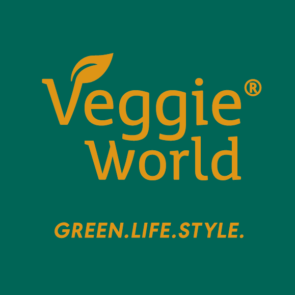 VeggieWorld_Logo_MitClaim_DarkGreen_Sand_CMYK